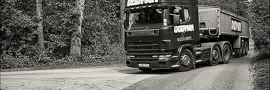 Dudman truck exiting a road. They have a haulage fleet of 40 vehicles varying from tippers, artics, mixers and sweepers.